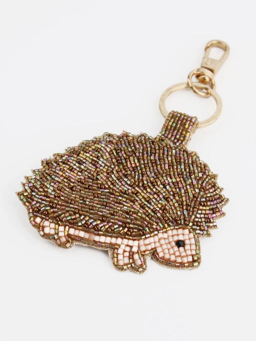 Beaded hedgehog keychain on a white background