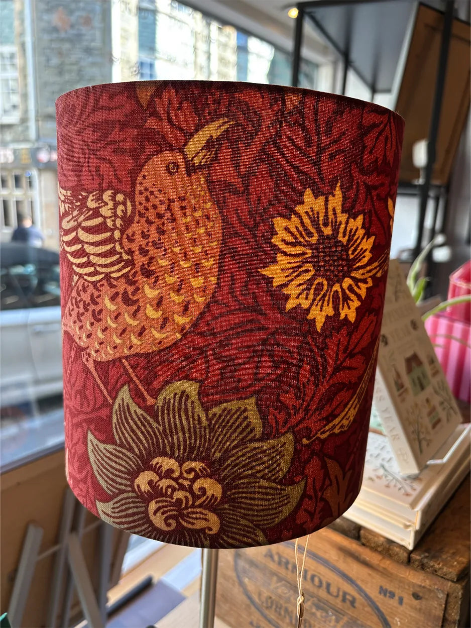 This beautiful handmade lampshade is covered in a fabulous blue and soft orange Liberty fabric. It will make a stunning design statement in any room.
