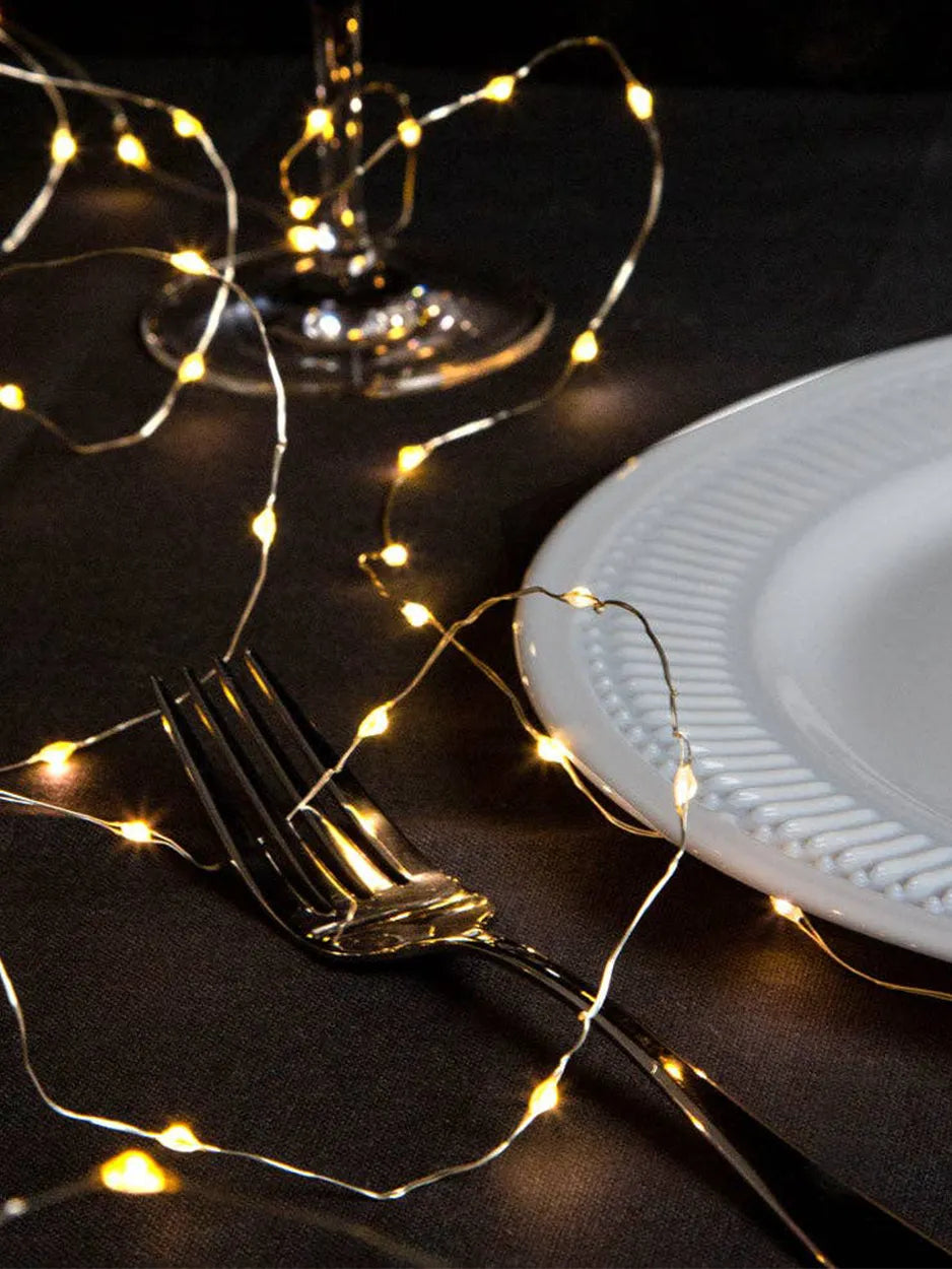 Create a warm, festive feel with these Gold LED String Lights. At 3 metres long, these battery-powered lights feature a gold glow, perfect for adding sparkle to table settings, wreaths, garlands or shelves.