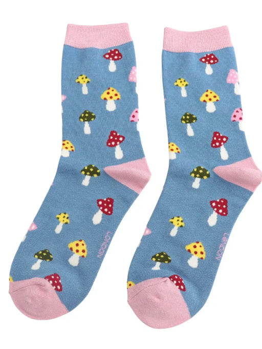 Pair of blue socks with colorful mushroom pattern on a white background