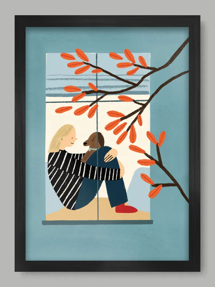 Framed artwork of two people embracing with a dog, surrounded by autumn leaves.